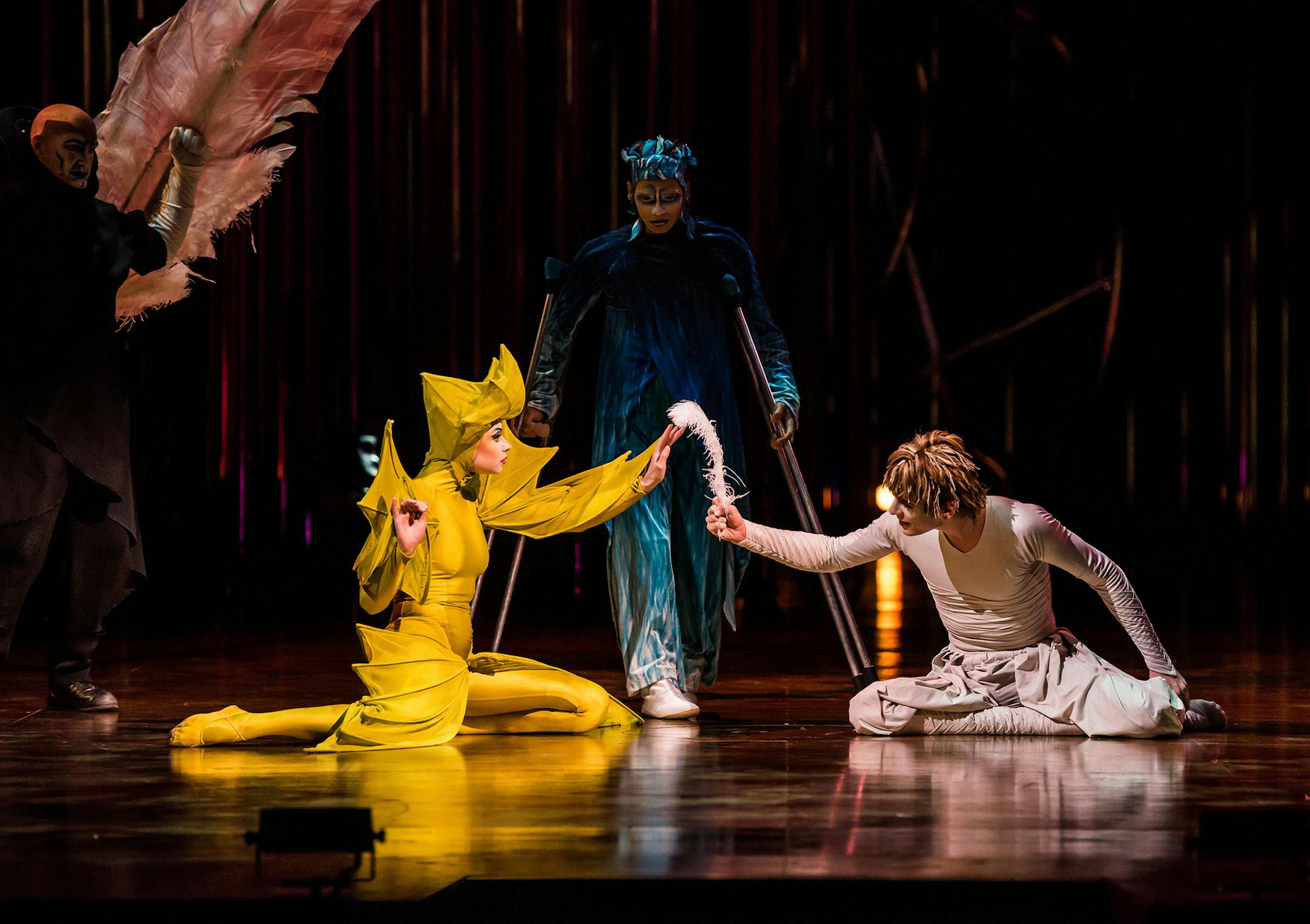 Icarus gives the only thing that remains of himself (a feather from his feathered wings) to the one he loves, the Promise, in Cirque du Soleil's "Verekai." Costumes by Eiko Ishioka.