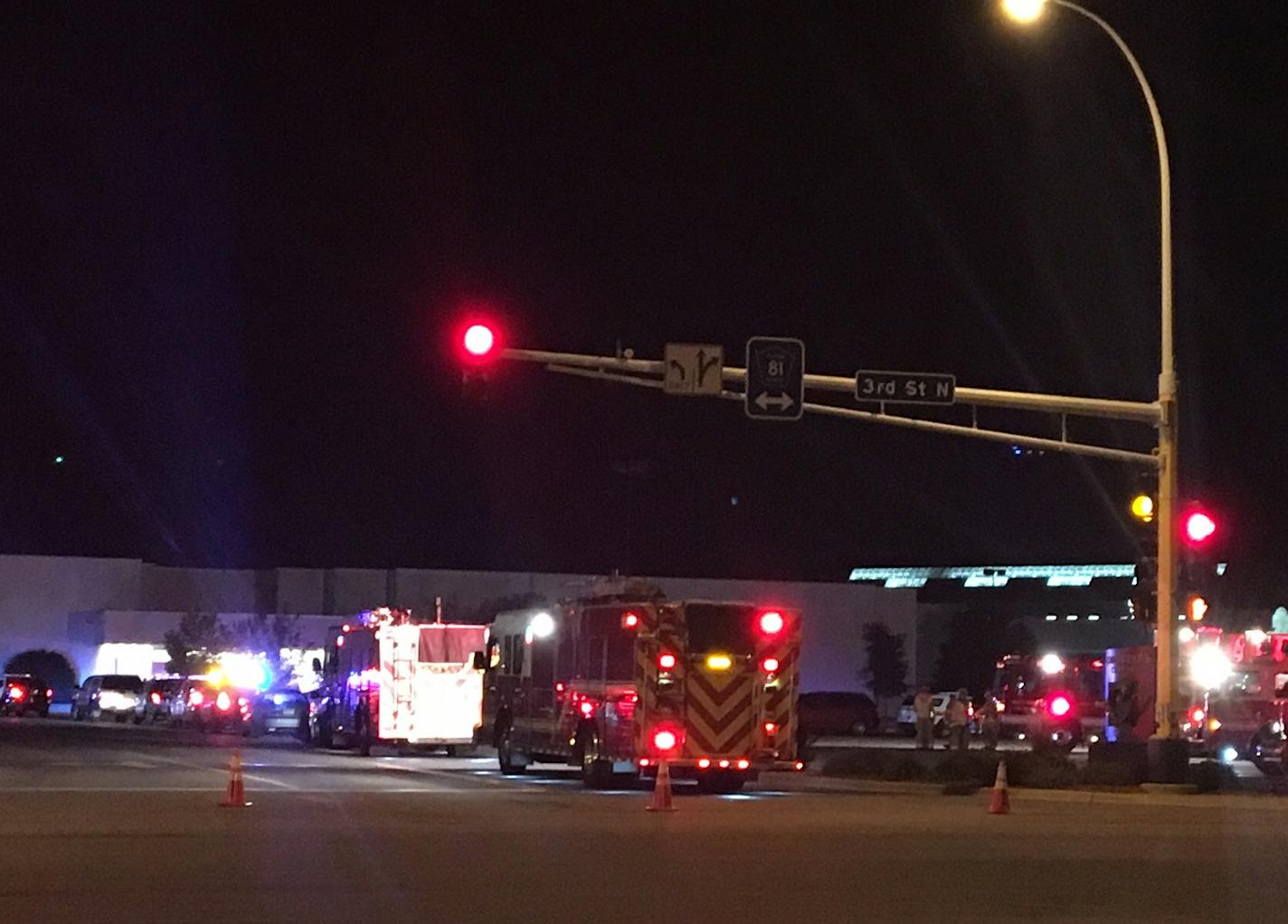 Emergency vehicles surround one end Crossroads Mall in St. Cloud on Saturday night after a man attacked multiple people.