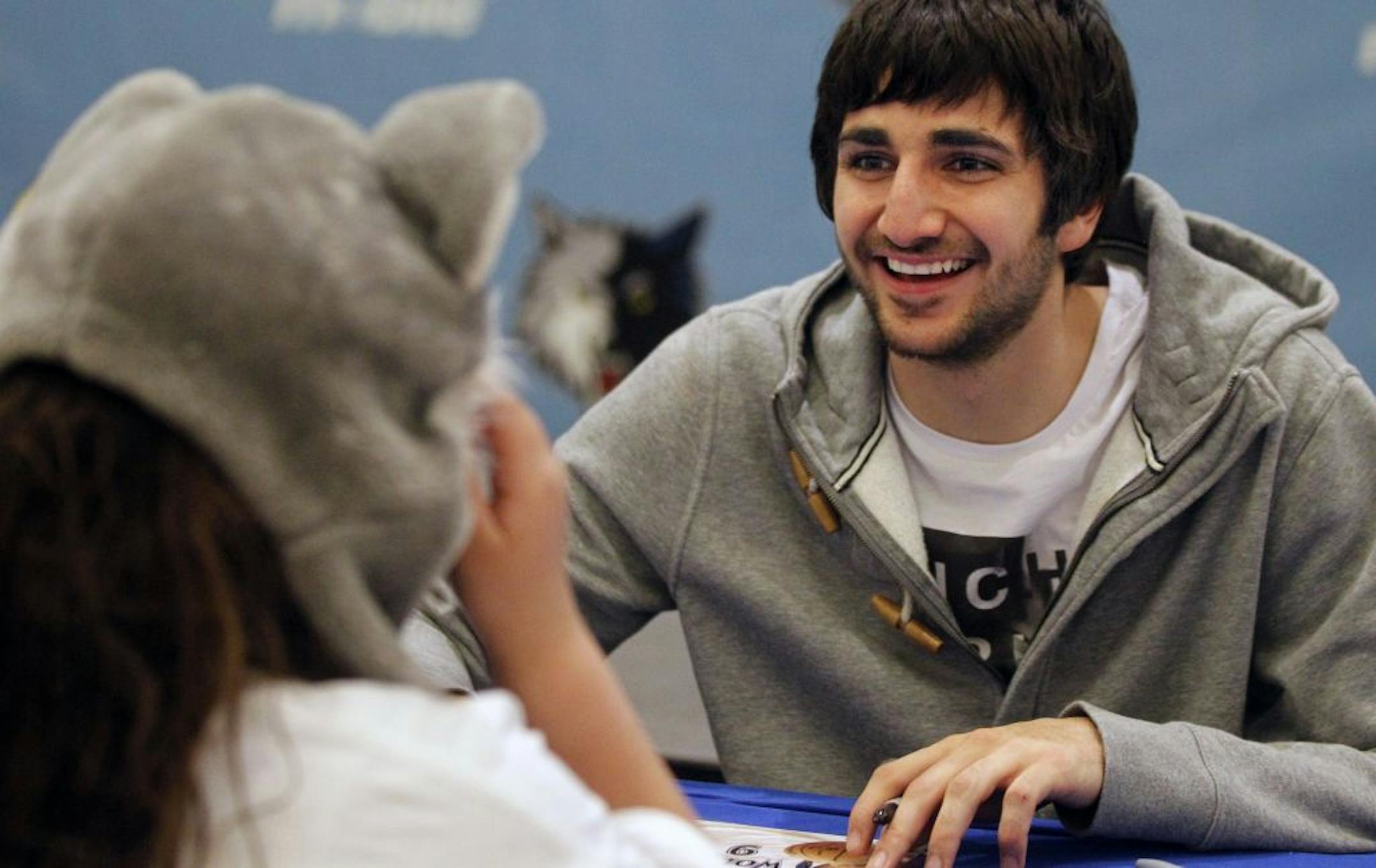 At the Ridgedale Center, Ricky Rubio greeted super fan Camryn Lahammer,8, who was wearing a Wolves hat. Lahammer said that Rubio had taken over Justin Bieber's place as his favorite star.