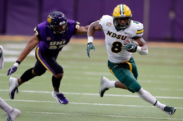 North Dakota State running back Bruce Anderson pulled away from Northern Iowa defensive back A.J. Allen during the first half of an Oct. 6 game in Ced