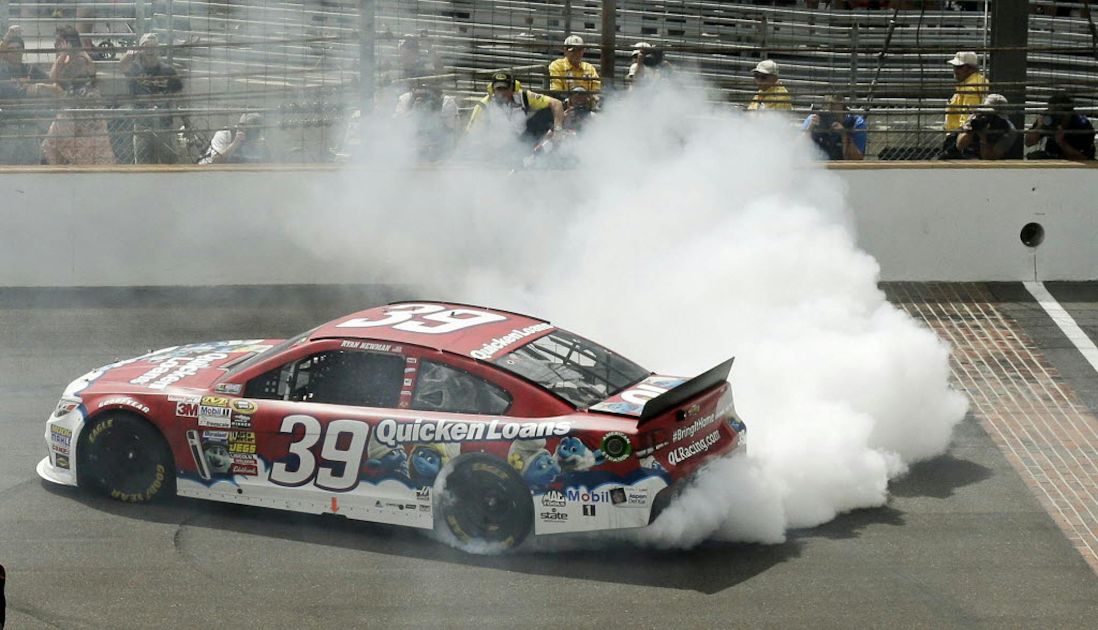 Sprint Cup Series driver Ryan Newman celebrates after winning the Brickyard 400 at the Indianapolis Motor Speedway.