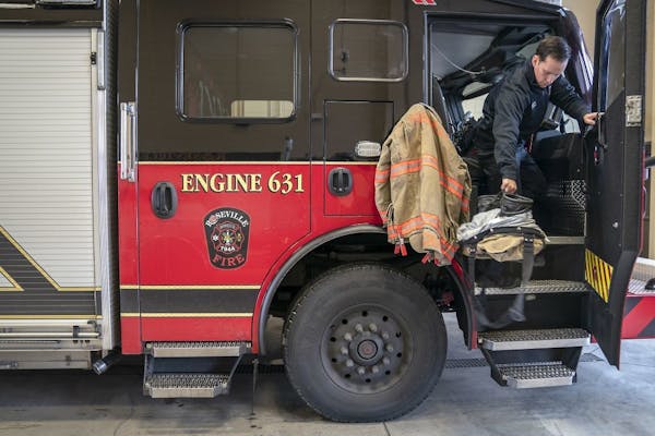 Roseville Fire Department Firefighter Dan Concha made his way off of a fire truck after a medical call, Friday, November 30, 2018 in Roseville, MN.