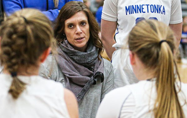 Minnetonka coach Leah Dasovich addresses her team during a timeout in 2020.