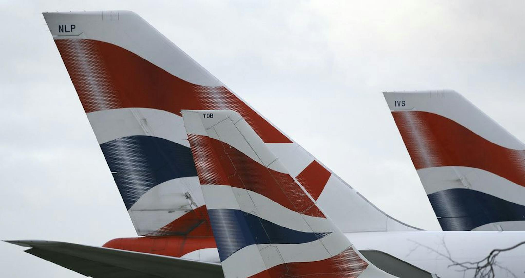 FILE - In this file photo dated Tuesday, Jan. 10, 2017, British Airways planes are parked at Heathrow Airport in London. ???????? The parent company of British Airways, International Airlines Group consortium is buying up to 42 Boeing 777 long-haul passenger jets in a multi-billion dollar deal announced Thursday Feb. 28, 2019.