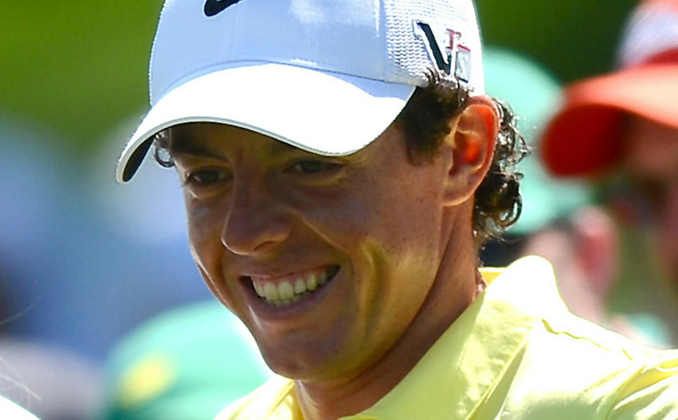 Rory McIlroy, right, smiles with his caddie/girlfriend Caroline Wozniacki at the 1st green during the Par 3 Contest at the Masters at Augusta National Golf Club on Wednesday, April 10, 2013, in Augusta, Georgia. (Jeff Siner/Charlotte Observer/MCT)