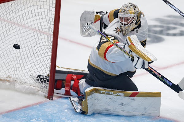 Vegas Golden Knights goaltender Adin Hill eyes the puck on a scoring shot by Dallas Stars center Radek Faksa during the third period in Game 7 of an N