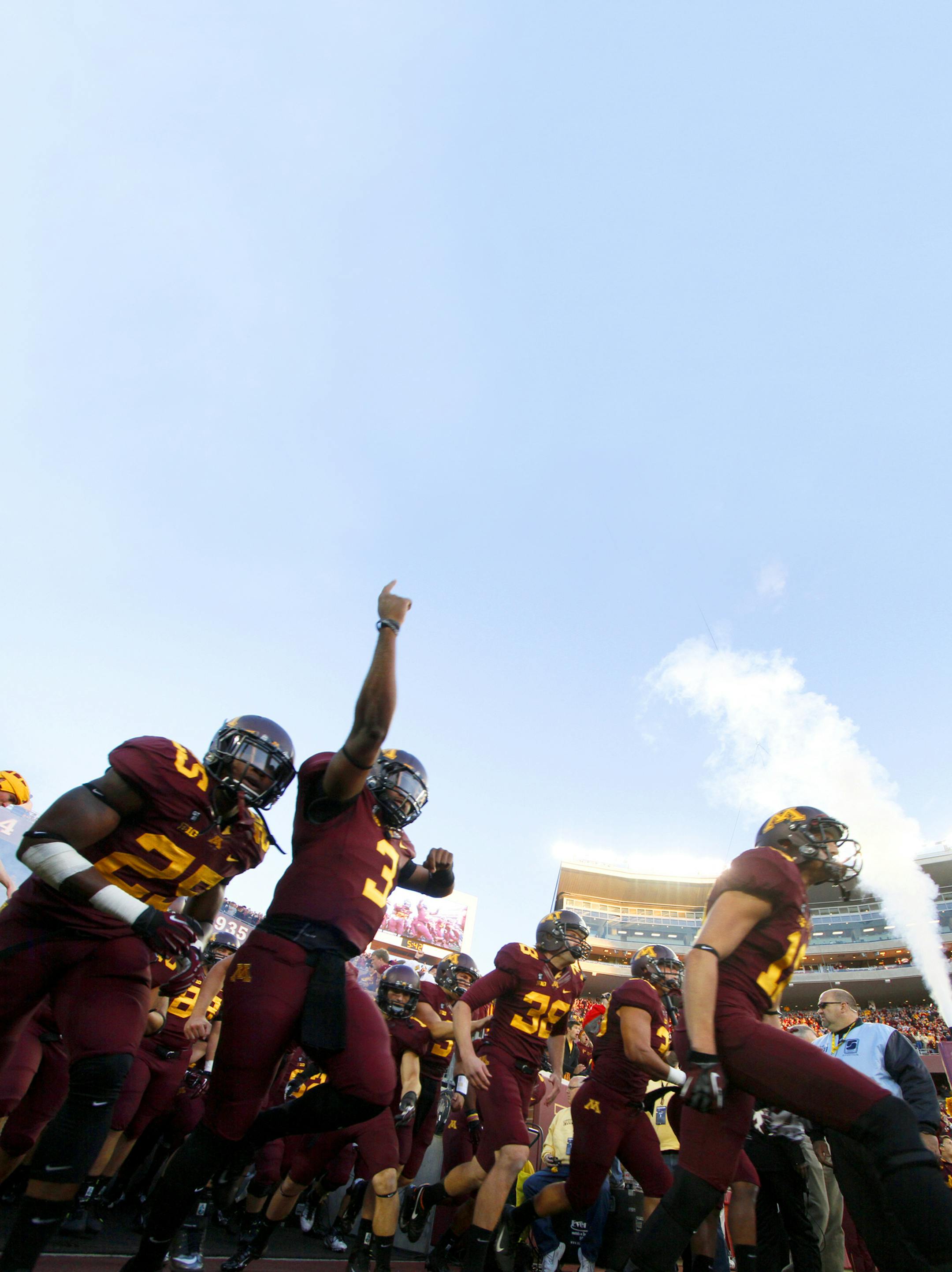 FILE - In this Sept. 22, 2012, file photo, Minnesota players take the field for an NCAA football game against Syracuse in Minneapolis. Minnesota enters Big Ten play as one of only three unbeaten teams in the conference, bringing plenty of confidence into the tougher part of the schedule. (AP Photo/Andy King, File) ORG XMIT: NY155 ORG XMIT: MIN1509021602501438