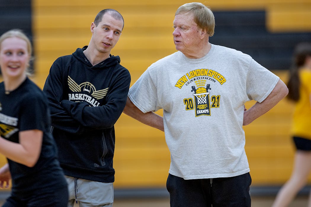 New London-Spicer girls basketball coach Mike Dreier, right, and his son Joey conferred during a practice in New London on Feb. 21. “He is demanding but super caring and he would do anything for them [players],” Joey said of his father, the winningest basketball coach in Minnesota.