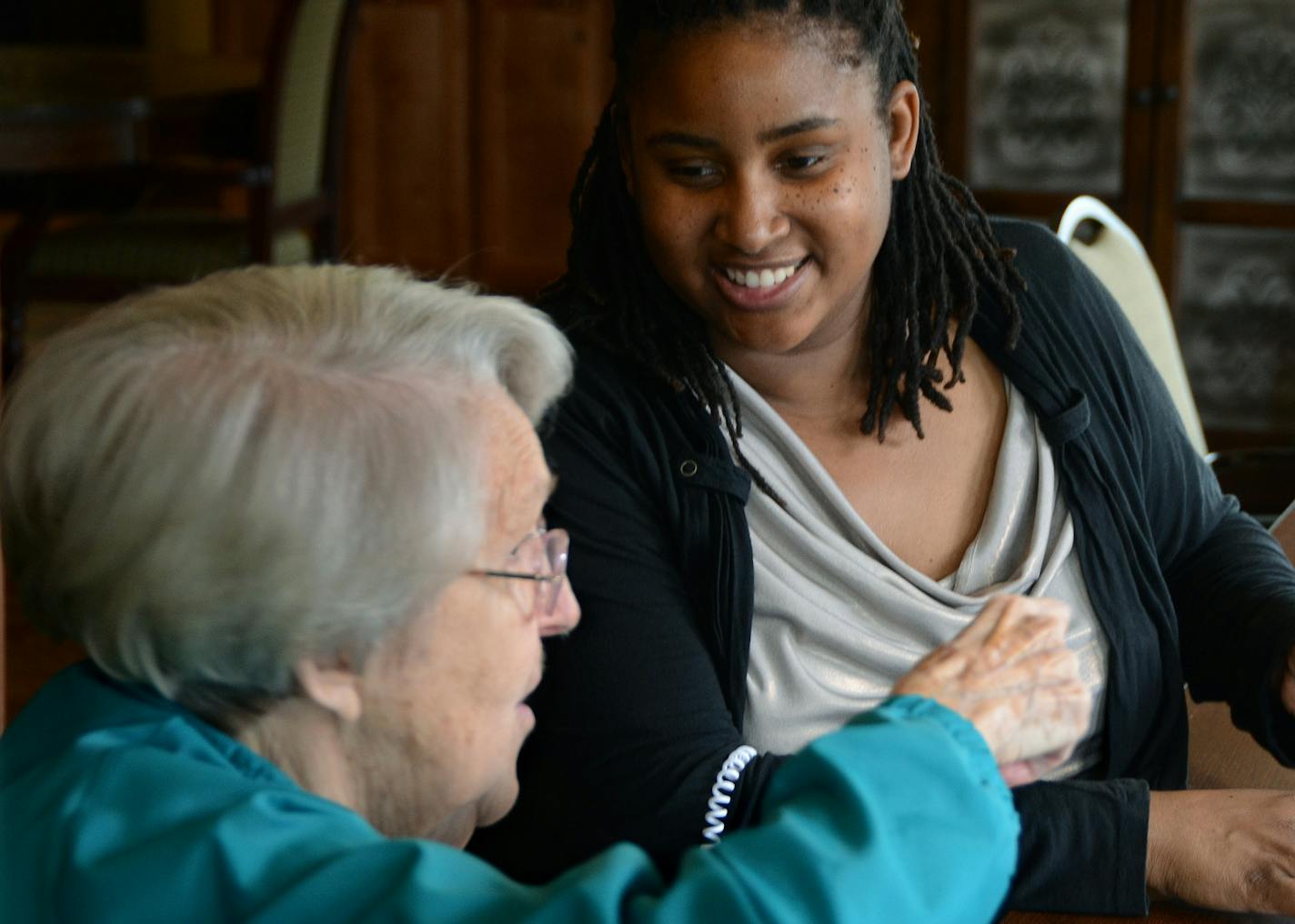 (Left to right) Virginia Bourgeois played a card game called Skip Bo with Activity Assistant Sanika Brown in Gardenview at York Gardens (Ebenezer's senior housing development in Edina). (Gardenview offers memory care apartments and is part of the York Gardens development.) ] Joey McLeister,Special to the Star Tribune,Edina,MN May29,2013