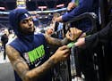 Timberwolves guard D'Angelo Russell (0) signed autographs for fans before a game in February.