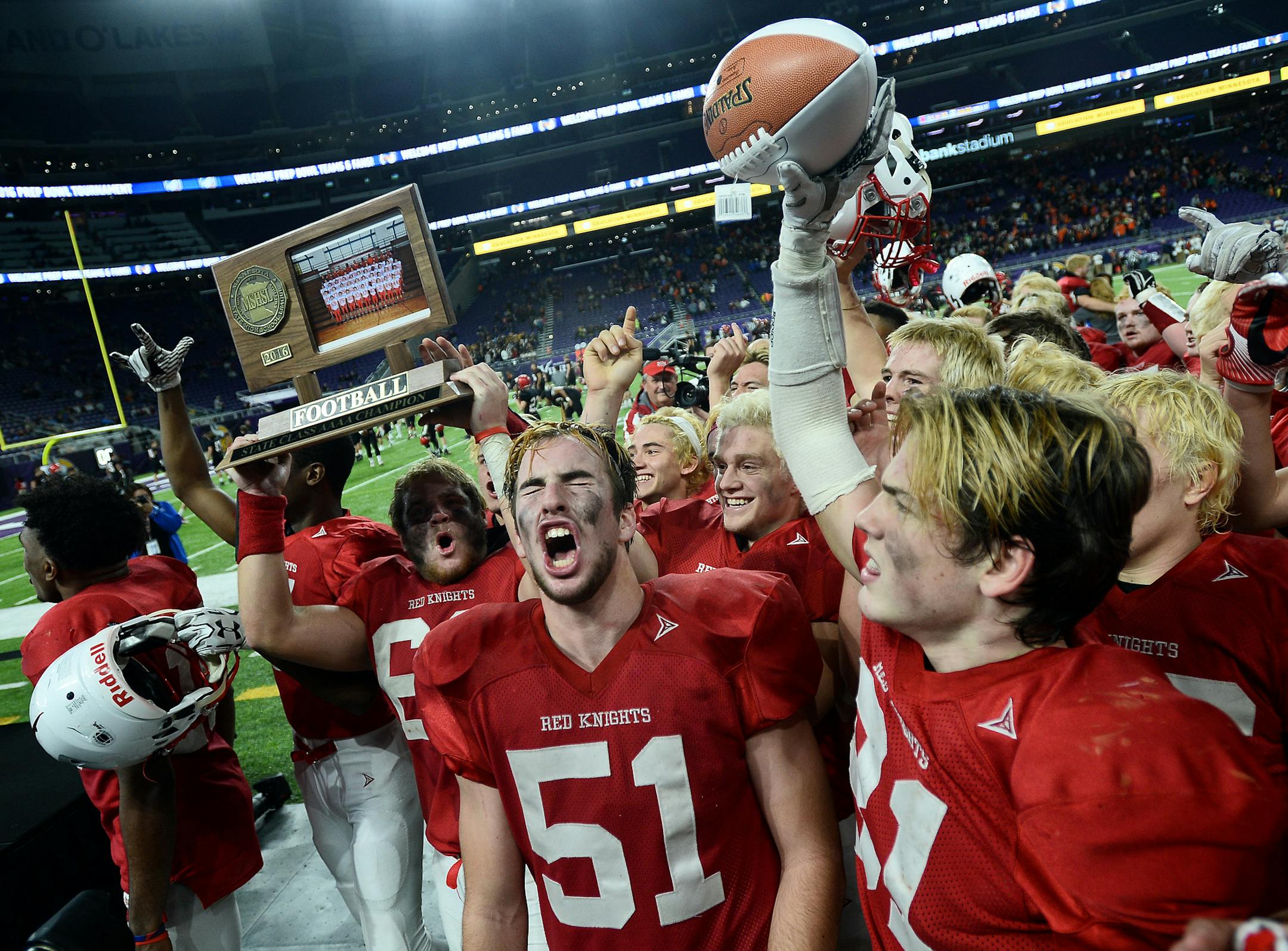 Benilde-St. Margaret's School players, including Benilde-St. Margaret's offensive lineman John Whitmore (51) celebrated with their 4A trophy after defeating Winona in the 4A championship game Friday night. ] (AARON LAVINSKY/STAR TRIBUNE) aaron.lavinsky@startribune.com Winona played Benilde-St. Margaret's in the Class 4A Championship Game of the the Prep Bowl on Friday, Nov. 25, 2016 at U.S. Bank Stadium in Minneapolis, Minn.