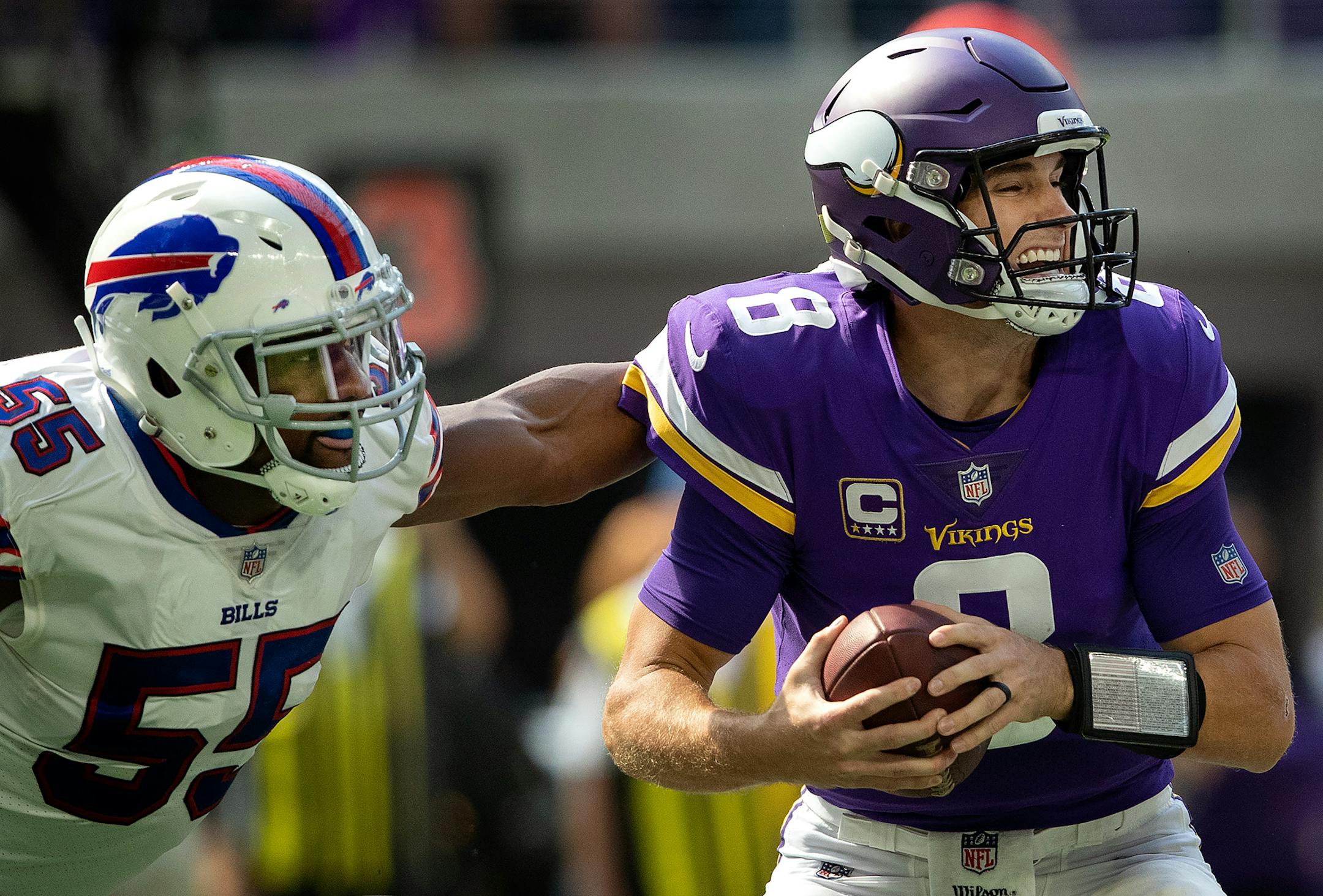 Minnesota Vikings Kirk Cousins (8) was pressured by Jerry Hughes (55) in the second quarter. ] CARLOS GONZALEZ • cgonzalez@startribune.com – September 23, 2018, Minneapolis, MN, US Bank Stadium, NFL, Minnesota Vikings vs Buffalo Bills
