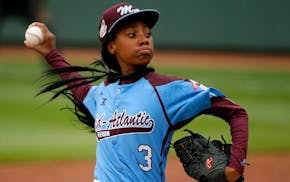 FILE - In this Aug. 15, 2014, file photo, Pennsylvania's Mo'ne Davis delivers in the fifth inning against Tennessee during a baseball game at the Litt