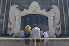 **FOR IMMEDIATE RELEASE** Visitors to the Bali bombing memorial look at the names of the victims and take photos, April 17, 2004, in Kuta Beach Bali, 