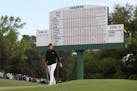 Jordan Spieth approaches the 18th green where he bogied to fall to 13 under for the round during the final round of the Masters at Augusta National Go