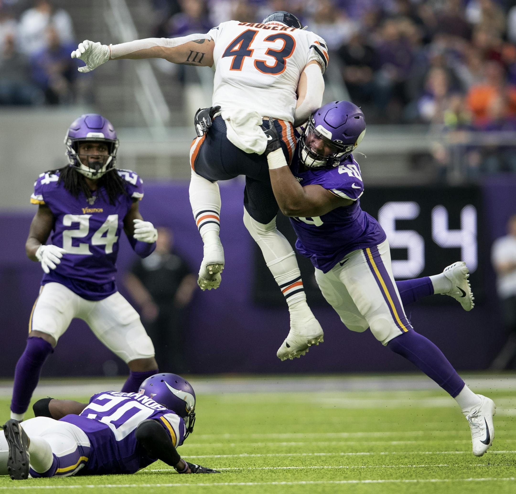 Minnesota Vikings Kentrell Brothers (40) tackled Chicago Bears Eric Saubert (43) in the second quarter.