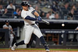 Giancarlo Stanton hits an RBI single against the Twins during the fourth inning Thursday in yet another win for the Yankees.