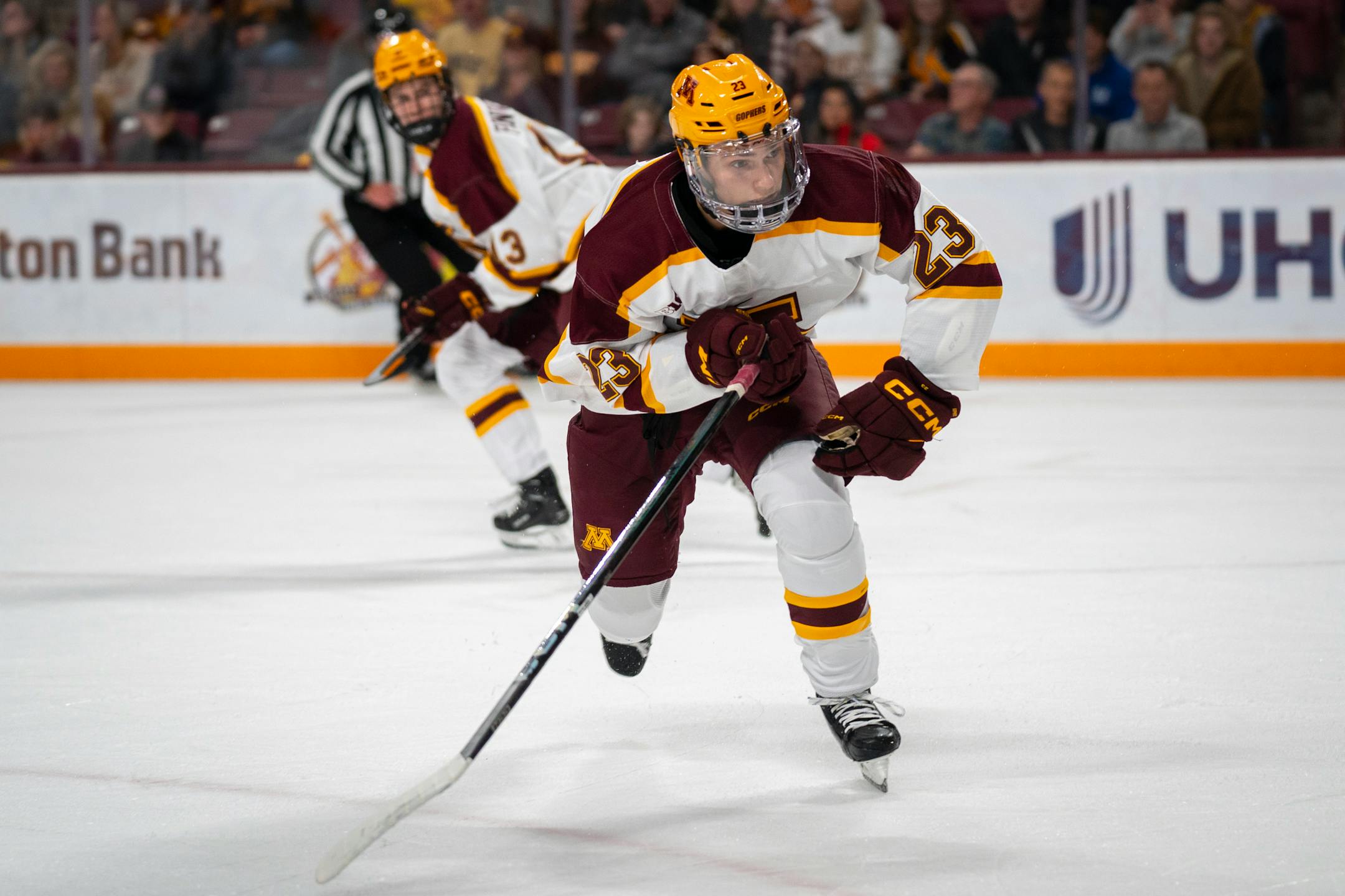 Minnesota forward Jimmy Clark (23) launches for the puck at the game against Wisconsin in 3M Arena at Mariucci on Friday, Oct. 27, 2023 in Minneapolis, Minn. Wisconsin won 3-2. ] Angelina Katsanis • angelina.katsanis@startribune.com
