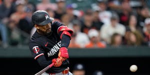 The Twins' Byron Buxton hits an RBI triple, his first triple in more than a year, against the Orioles during the fourth inning Tuesday in Baltimore.