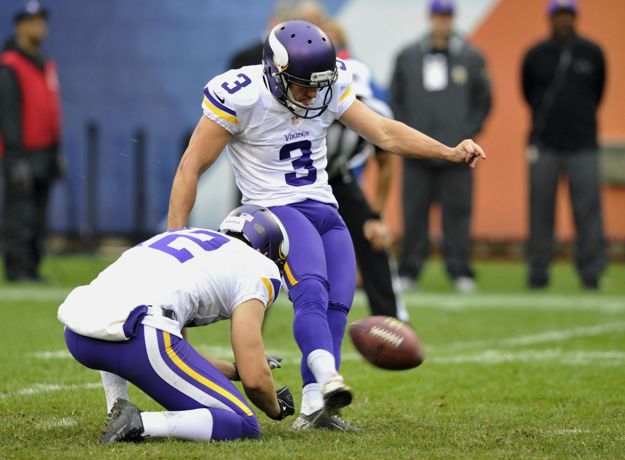 Minnesota Vikings' Blair Walsh (3) kicks a 28-yard field goal against the Chicago Bears during the second half of an NFL football game on Sunday, Sept. 15, 2013, in Chicago. Punter Jeff Locke (12) holds. (AP Photo/Jim Prisching)