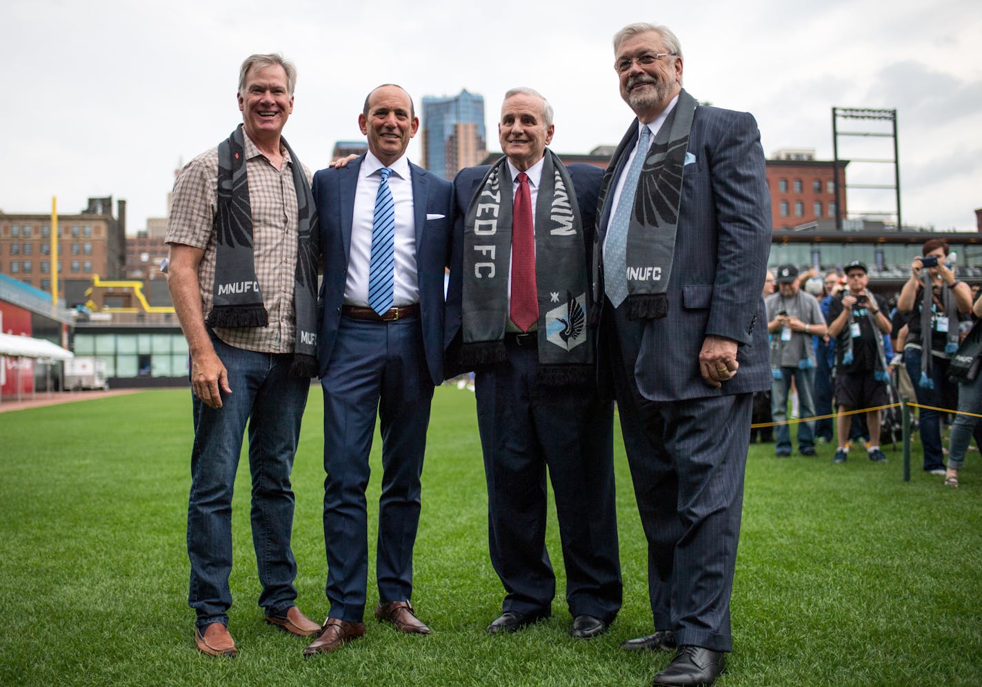 Minnesota United majority owner Dr. William McGuire, far right, celebrates Minnesota United FC's move to the MLS in August, just days after St. Paul approved plans to build a $150 million soccer stadium in the Midway neighborhood. From left, St. Paul Mayor Chris Coleman, MLS Soccer Commissioner Don Garber, and Minnesota Governor Mark Dayton posed with McGuire at CHS Field.