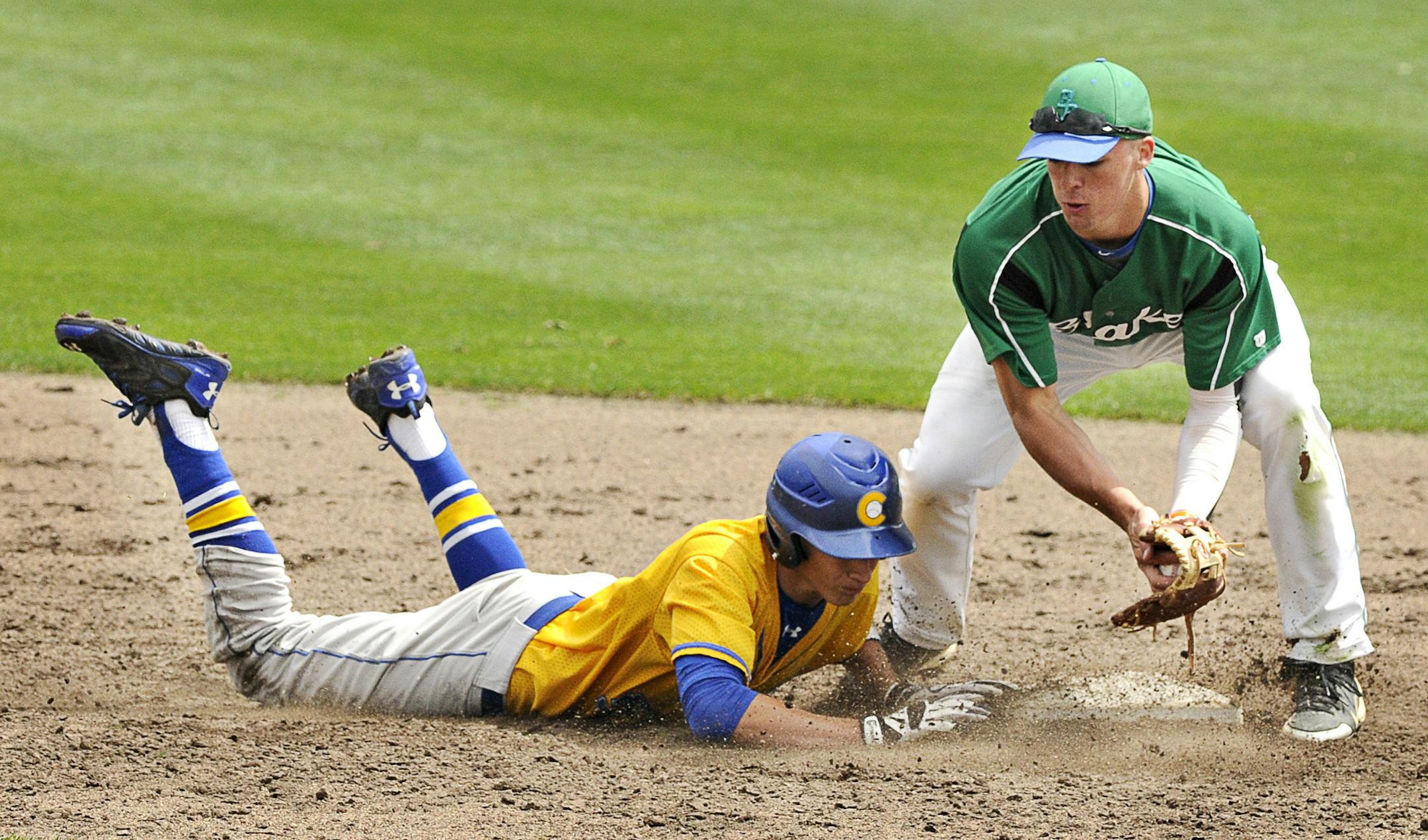 St. Cloud Cathedral's Dominic Austing dives safely back into second base before the tag attempt by Blake's Mark Lyman in the fifth inning of the state quarterfinal game at Dick Putz Field Thursday, June 12. Cathedral beat Blake 5-1. MANDATORY CREDIT: JASON WACHTER - St. Cloud Times