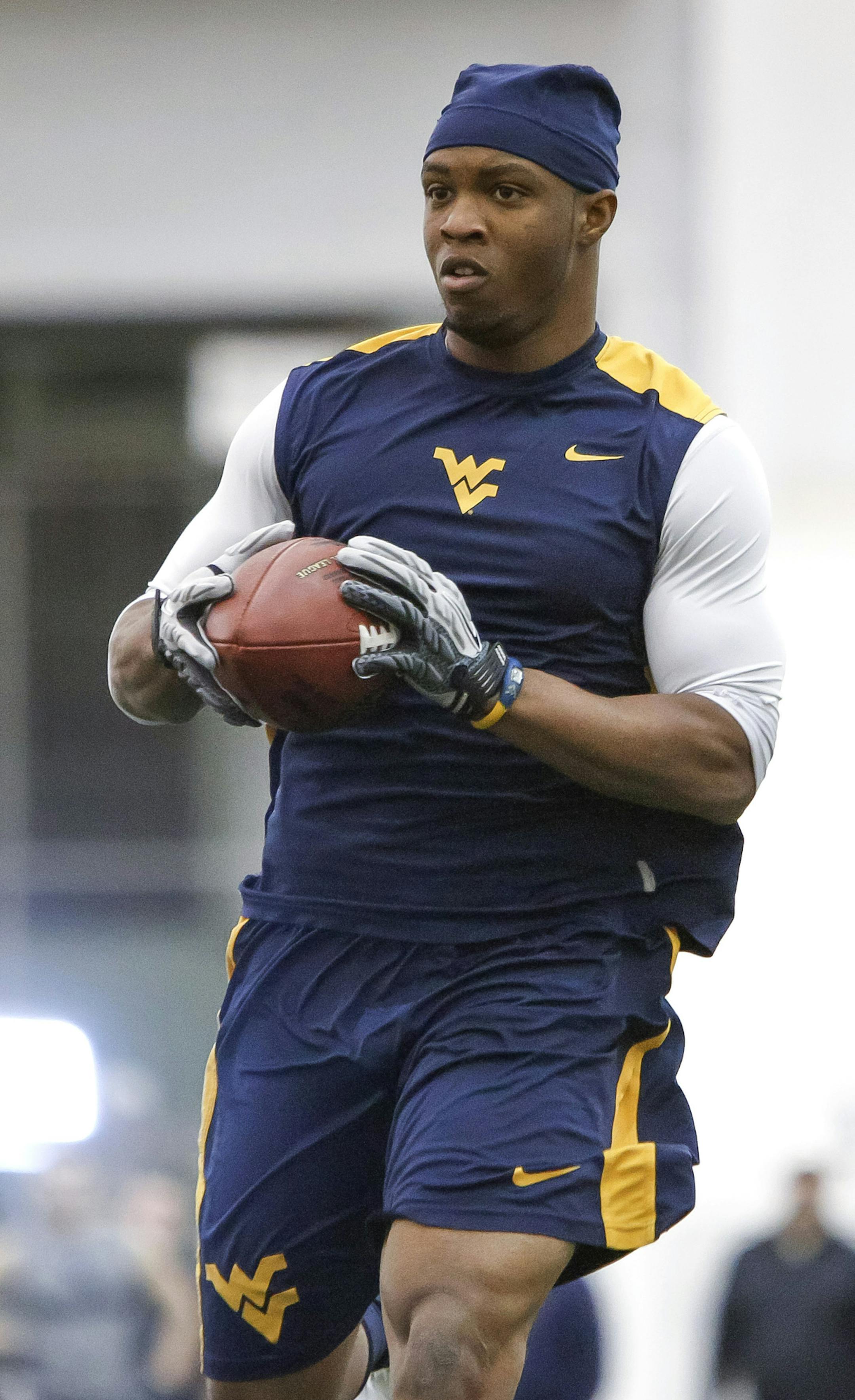 Tavon Austin catches a pass during West Virginia University football Pro Day in Morgantown, W.Va., on Thursday, March 14, 2013. (AP Photo/David Smith) ORG XMIT: MIN2013041616461626
