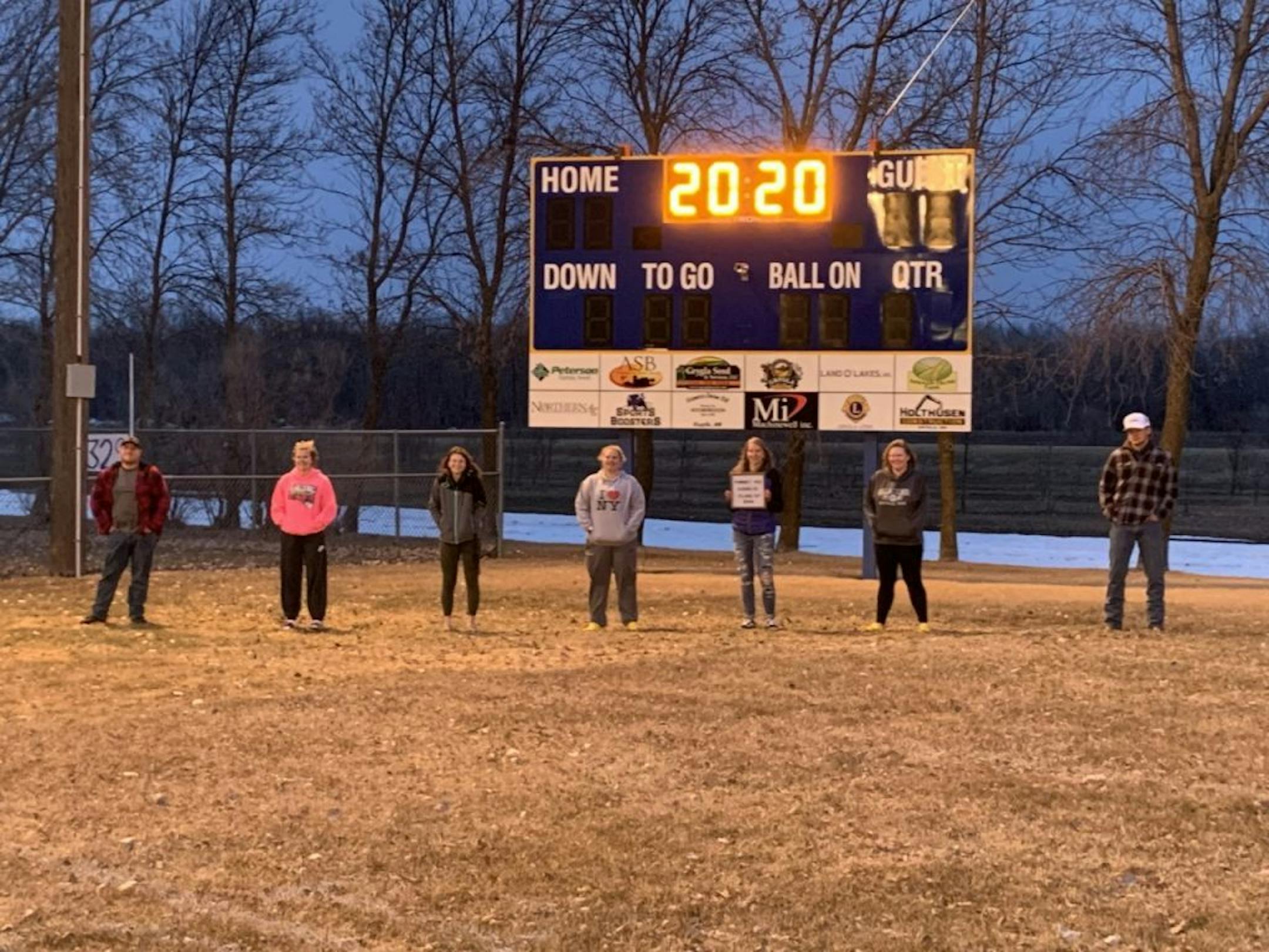 People stood at on the football field at Grygla High School