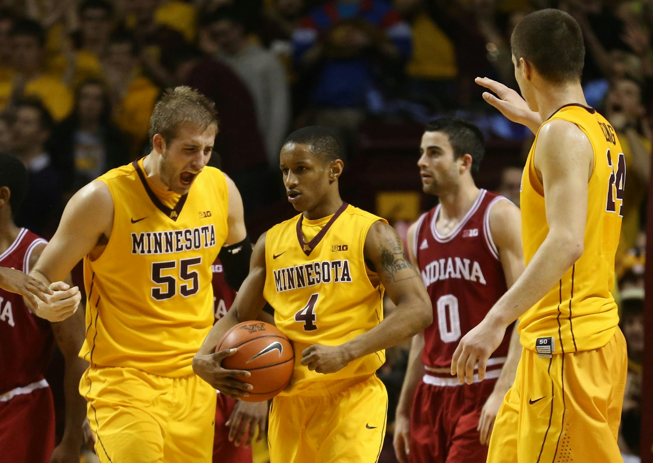 Gopher DeAndre Mathieu celebrated with teammates after drawing a foul during the second half at Williams Arena in Minneapolis, Saturday, February 8, 2014. Gophers beat Indiana 66-60.