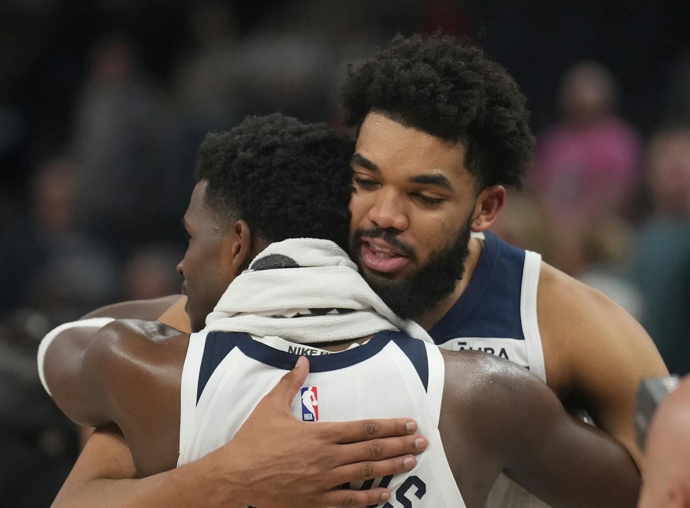 Minnesota Timberwolves guard Anthony Edwards (1) and Minnesota Timberwolves center Karl-Anthony Towns (32) hug after the victory over the Pelicans in Minneapolis, Minn., on Sunday, April 9, 2023. Minnesota Timberwolves take on the New Orleans Pelicans at Target Center in last game of regular season.] RICHARD TSONG-TAATARII • richard.tsong-taatarii @startribune.com