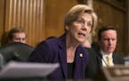 FILE &#xf3; Sen. Elizabeth Warren (D-Mass.) questions Betsy DeVos, Donald Trump's pick for education secretary, at her confirmation hearing before the