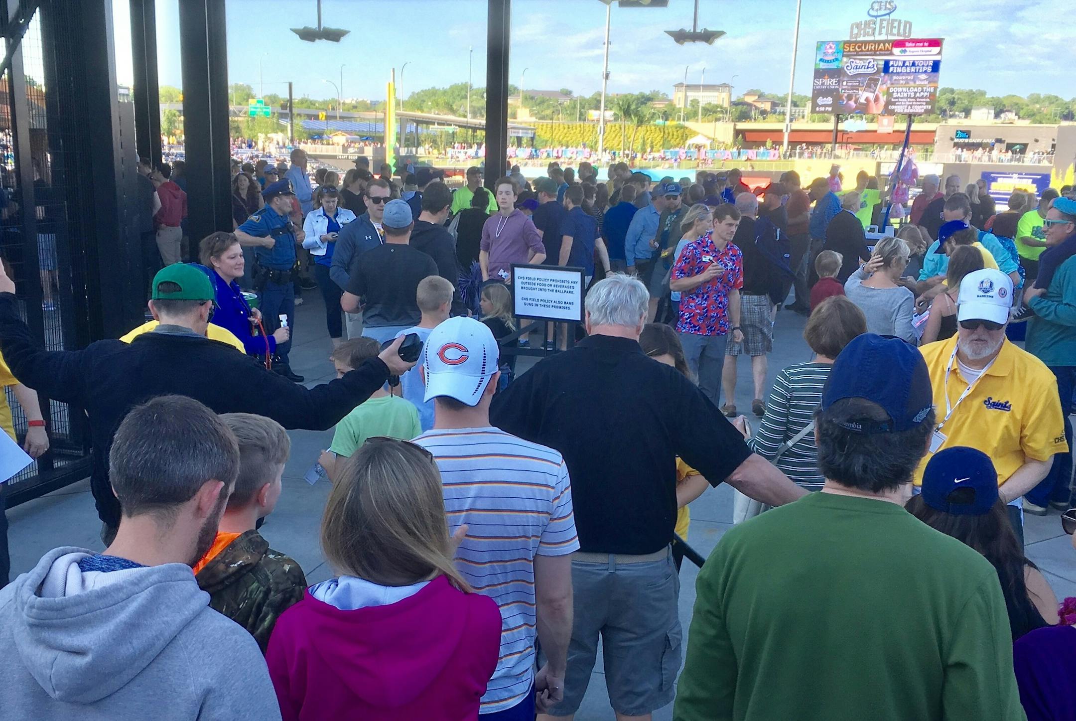 Fans entering CHS Field paused to have a metal-detecting wand go over their bodies Saturday.