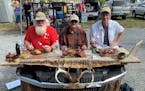 Writer Spike Carlsen, right, and other judges dug into a venison entry at the Roadkill Cook-off in Marlinton, W. Va.