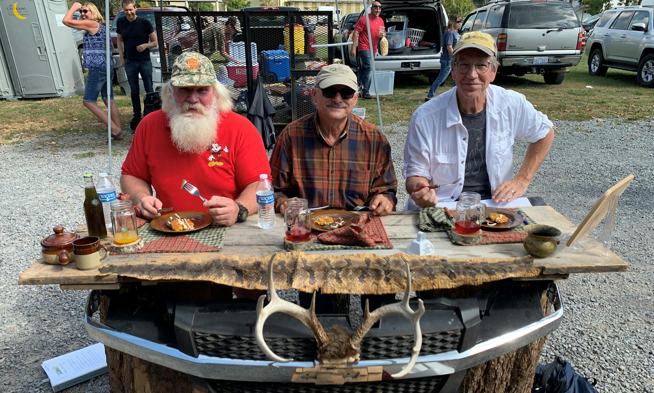 Writer Spike Carlsen, right, and other judges dug into a venison entry at the Roadkill Cook-off in Marlinton, W. Va.