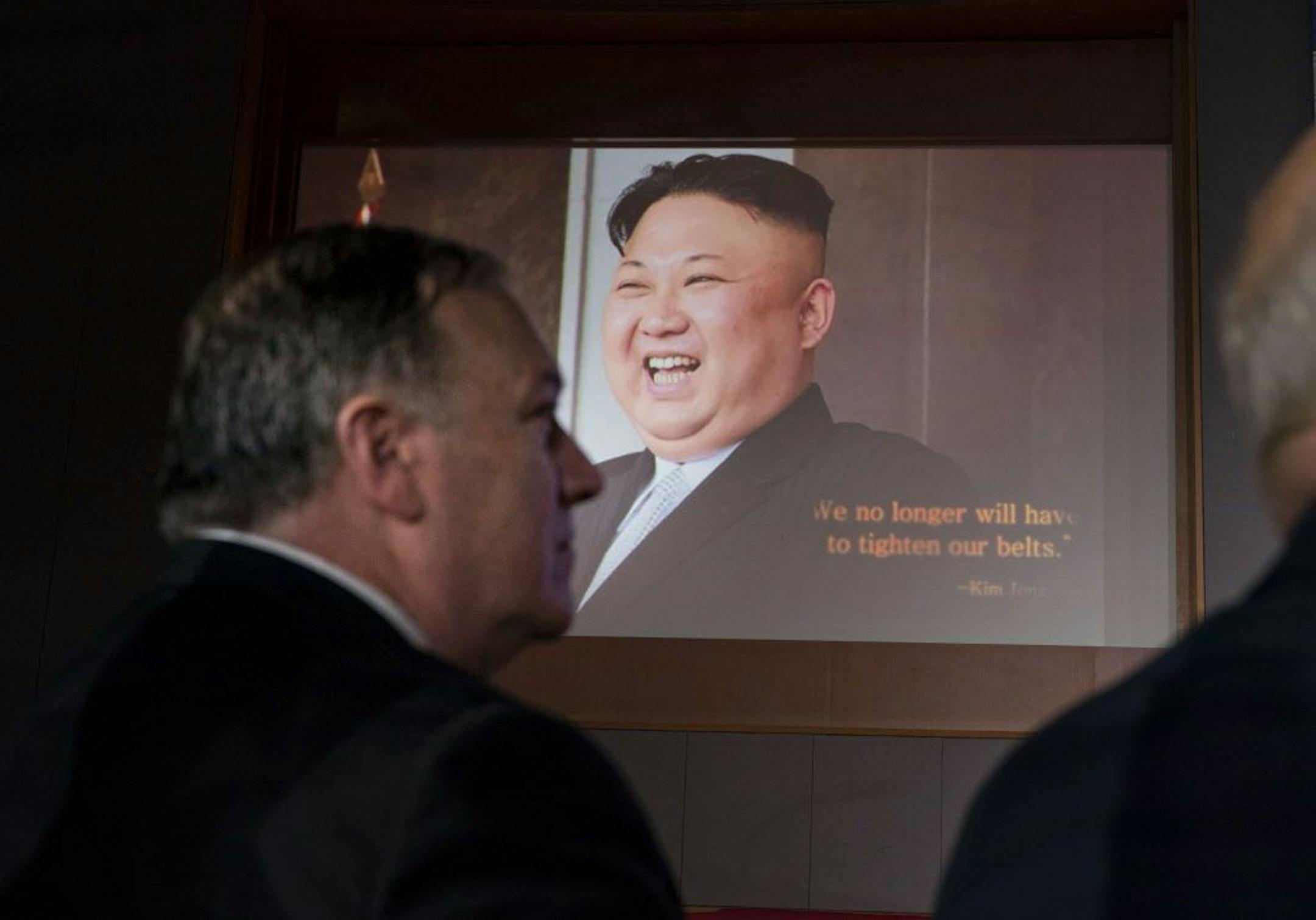 Secretary of State Mike Pompeo looks on as a film is played before President Donald Trump spoke at a news conference, after meeting with Kim Jong Un of North Korea on Sentosa Island in Singapore, June 12, 2018. The two leaders signed what Trump called a "comprehensive document." Trump indicated that a process of denuclearization on the Korean Peninsula could begin "very quickly.