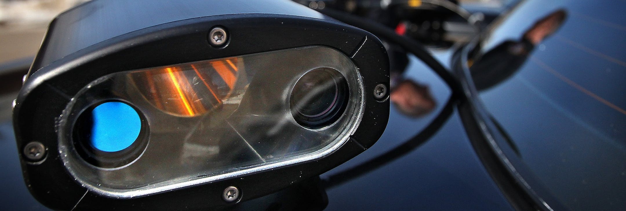 FILE - In this March 18, 2011, file photo, Maplewood, Minn., police officer Steven Hiebert prepares to go out on patrol using the License Plate Ready System, which consists of a camera that photographs license plates and then compares them with those in a database of stolen vehicles. Oregon privacy advocates argue that police shouldnít be able to track peopleís movements, particularly without suspicion of criminal activity. (AP Photo/Star Tribune, Jim Gehrz, File)