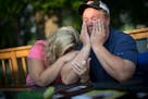 Shelley Fenton cried into her husband Al Fenton's arm as he tearfully told the story about his two-year-old son Benny's death while riding with him on