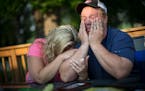 Shelley Fenton cried into her husband Al Fenton's arm as he tearfully told the story about his two-year-old son Benny's death while riding with him on