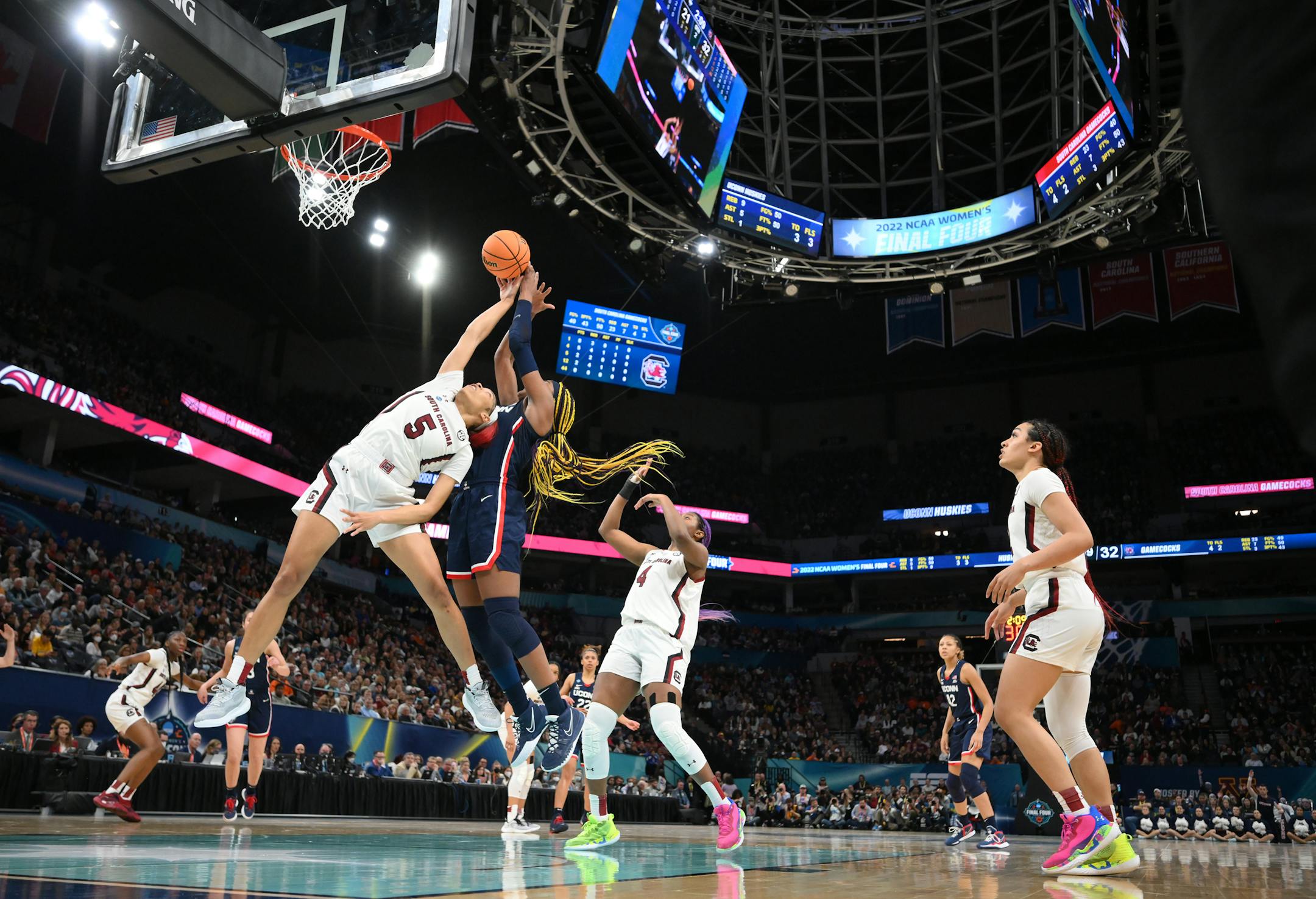 South Carolina forward Victaria Saxton (5) and UConn forward Aaliyah Edwards (3) reach for a rebound during the second quarter.