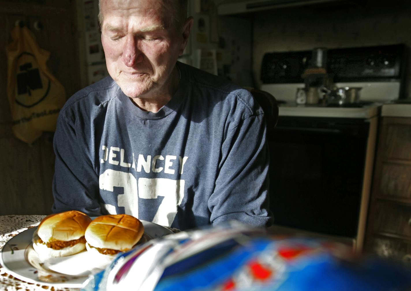 In rural Montgomery, Greg Thomas is restoring a chapel as an act of devotion for God allowing him to beat an inoperable stage 4 cancer. He is giving thanks for supper. For over four years he had to eat through a feeding tube because of his canccer.]richard.tsong-taatarii/rtsong-taatarii@startribune.com