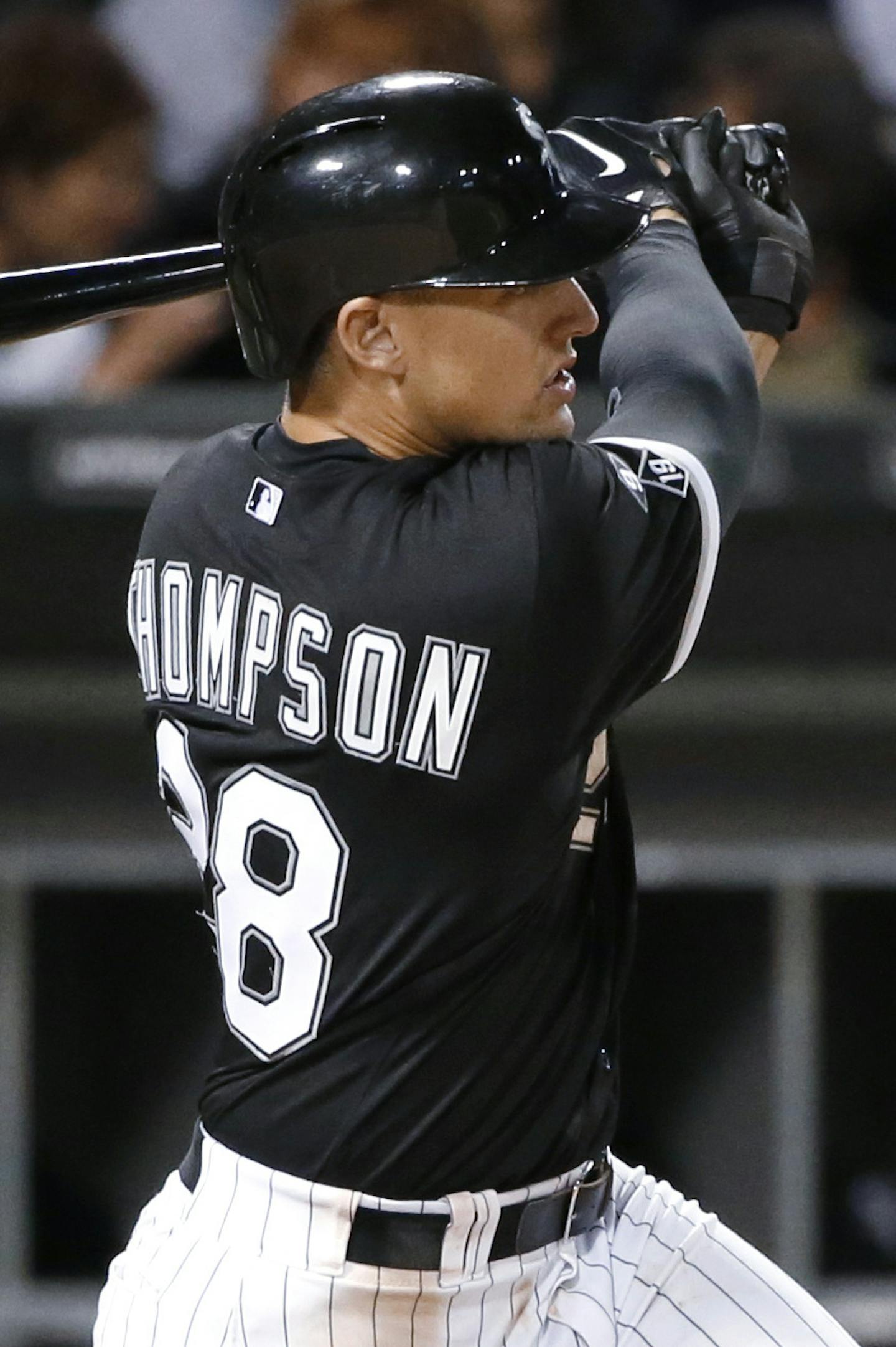 Chicago White Sox's Trayce Thompson watches his two-run double off Boston Red Sox starting pitcher Wade Miley during the seventh inning of a baseball game Tuesday, Aug. 25, 2015, in Chicago. (AP Photo/Charles Rex Arbogast) ORG XMIT: MIN2015090418240457