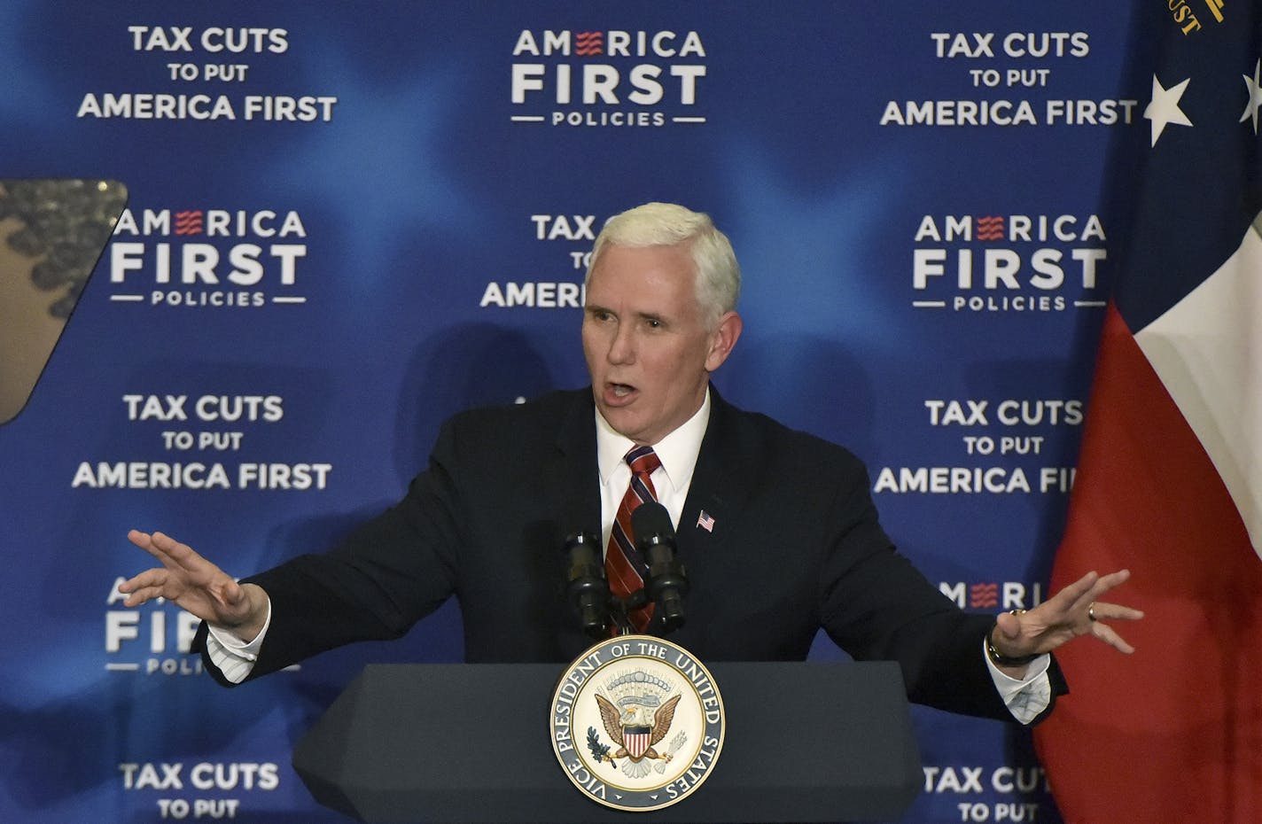 Vice President Mike Pence delivers remarks at an America First Policies event, as part of a series called "Tax Cuts to Put America First" at the Loews Atlanta Hotel on Friday, March 23, 2018. (Hyosub Shin/Atlanta Journal-Constitution via AP)