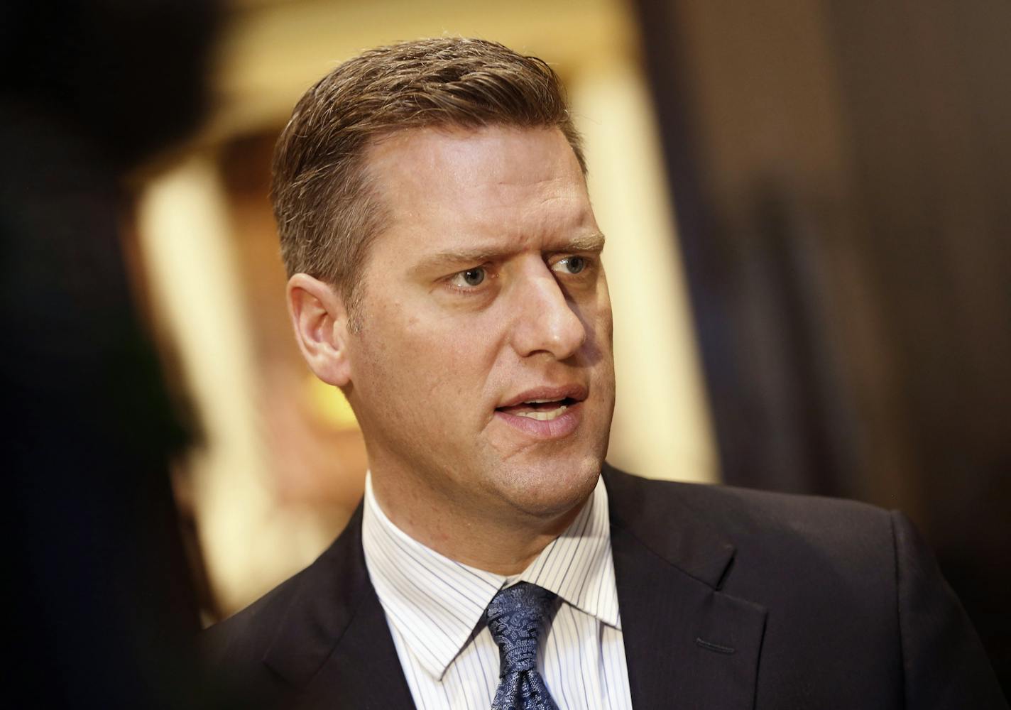 FILE - In this May 10, 2017, file photo, Minnesota Republican House Speaker Kurt Daudt fields a question from reporters outside the House chamber in St. Paul, Minn. (AP Photo/Jim Mone, File)