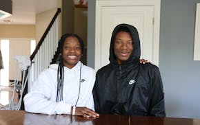 Math & Science Academy sophomore McKaylen Lewis poses for a photo at home with with her older brother, senior Malcolm Lewis. The pair are working thro