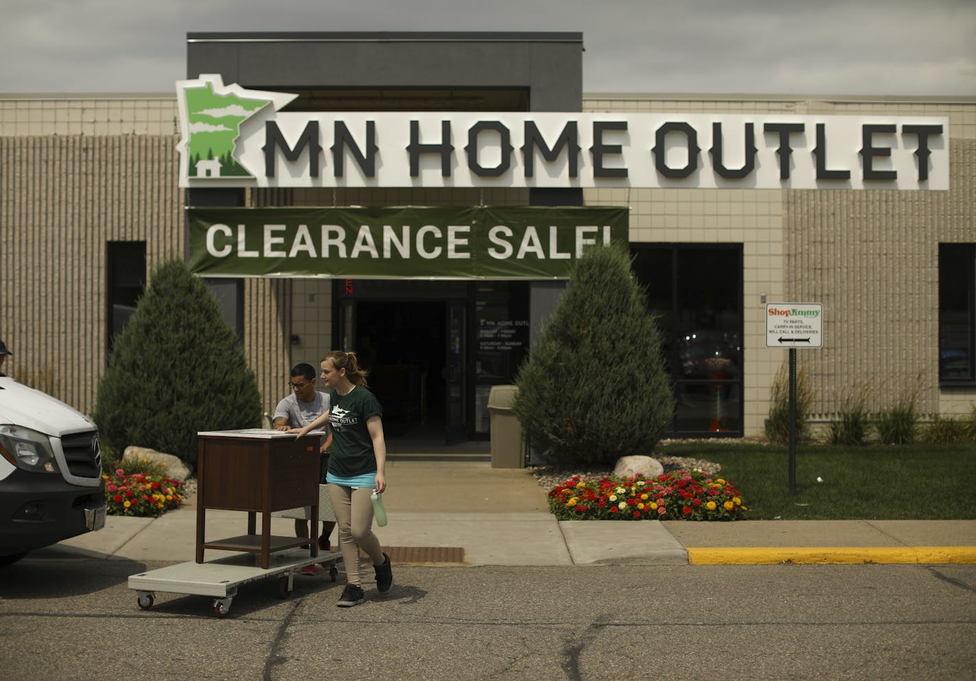 Store employees brought a bathroom vanity out to a customer&#x2019;s car at MN Home Outlet in Burnsville in July.