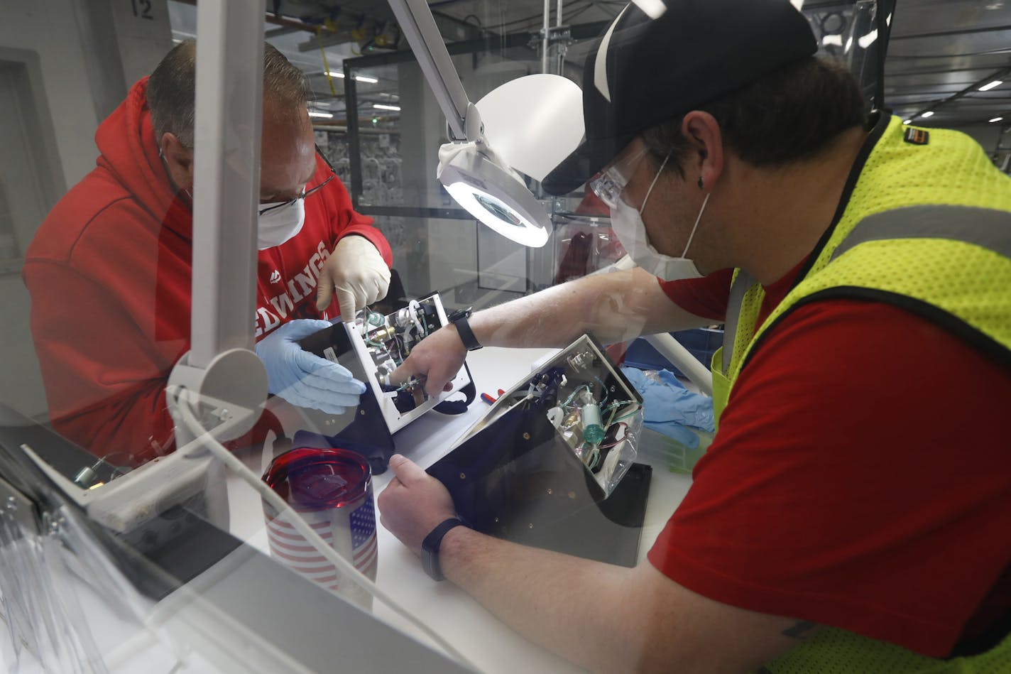 Manufacturing conditions across the country and Midwest turned marginally positive in June, surveys of supply managers showed. File photo of workers at a Ford Motor Co. plant that was converted into a ventilator factory in Michigan.