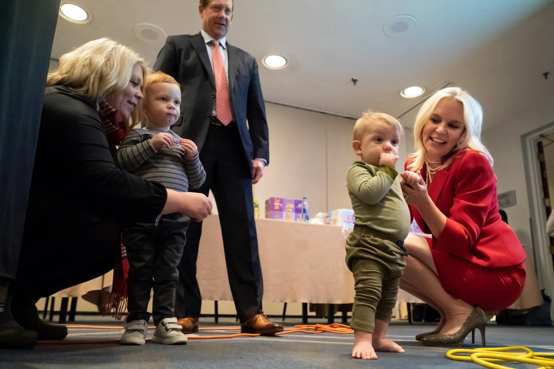 Karin Housely, Republican candidate for U.S. Senate, played with her grandchildren Louis, 3 , and Archer, 1,in the war room. She and husband Phil also watched early results.