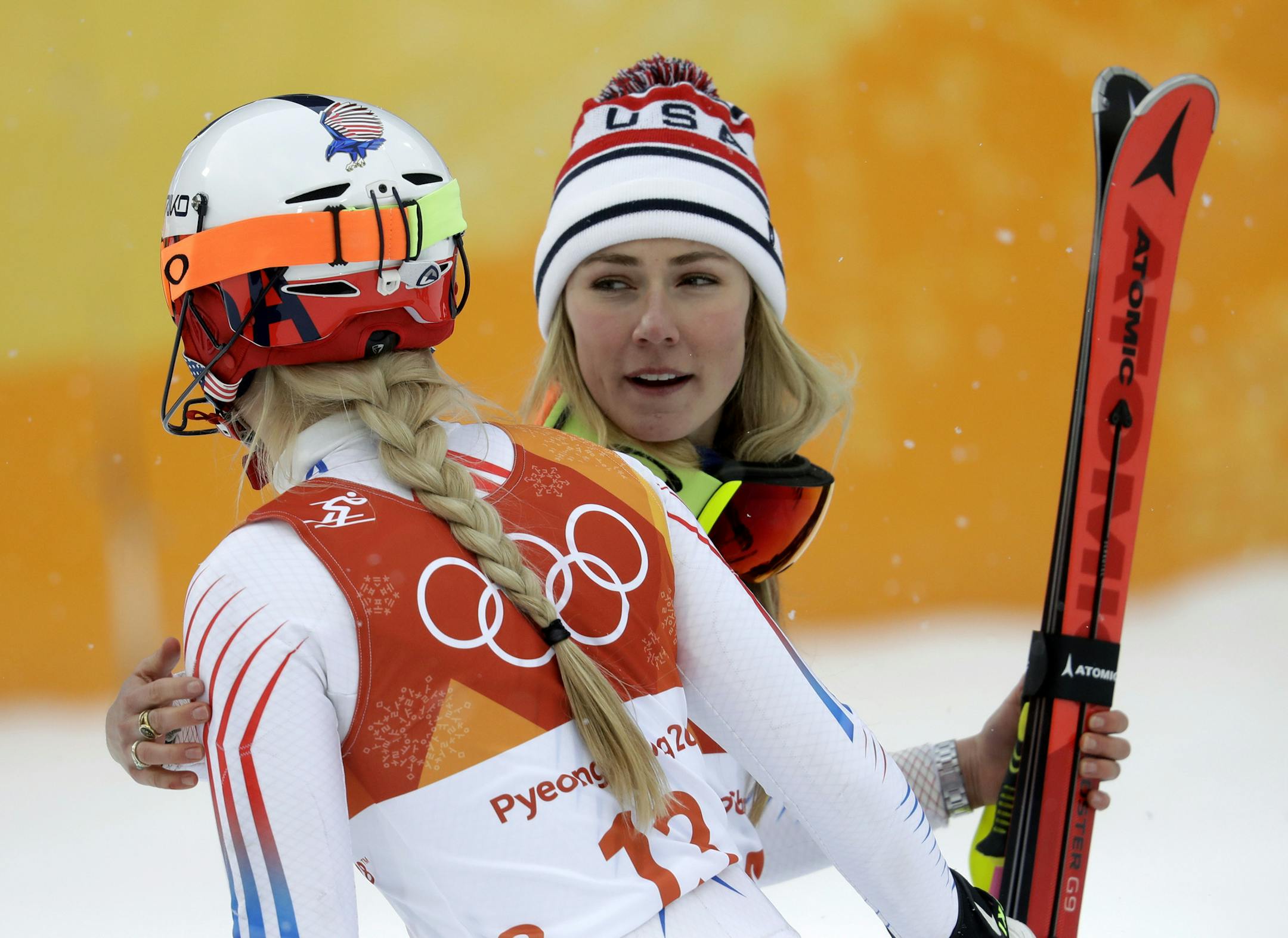 Mikaela Shiffrin, of the United States, right, hugs compatriot Lindsey Vonn after the women's combined slalom at the 2018 Winter Olympics in Jeongseon, South Korea, Thursday, Feb. 22, 2018. (AP Photo/Michael Probst)