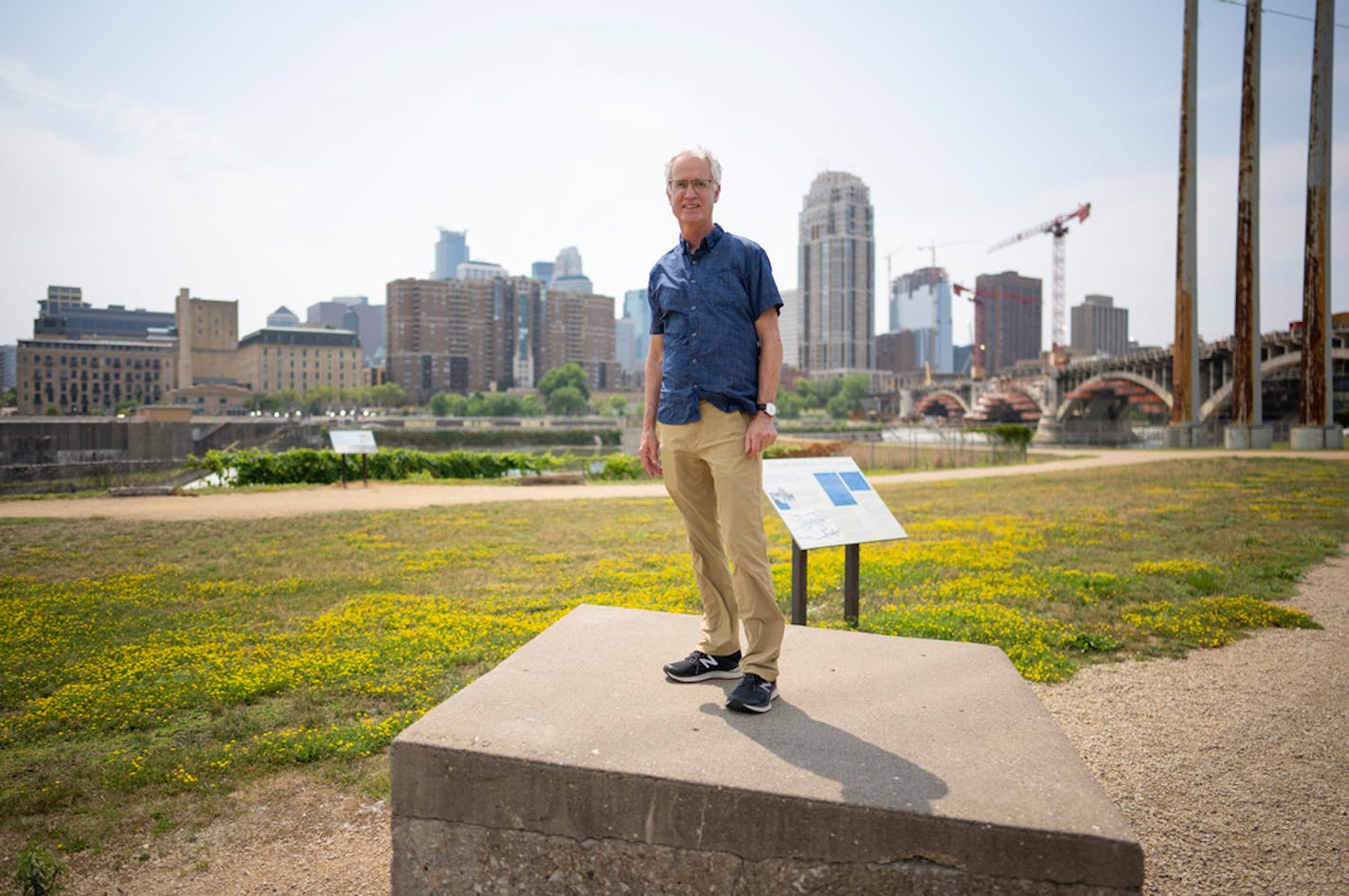 Riverfront historian John Anfinson stood on the capped entrance to the Eastman Tunnel near St. Anthony Falls. ] JEFF WHEELER • jeff.wheeler@startribune.com