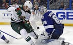 Tampa Bay Lightning goalie Andrei Vasilevskiy, of Russia, makes a save against Minnesota Wild's Eric Staal during the third period of an NHL hockey ga